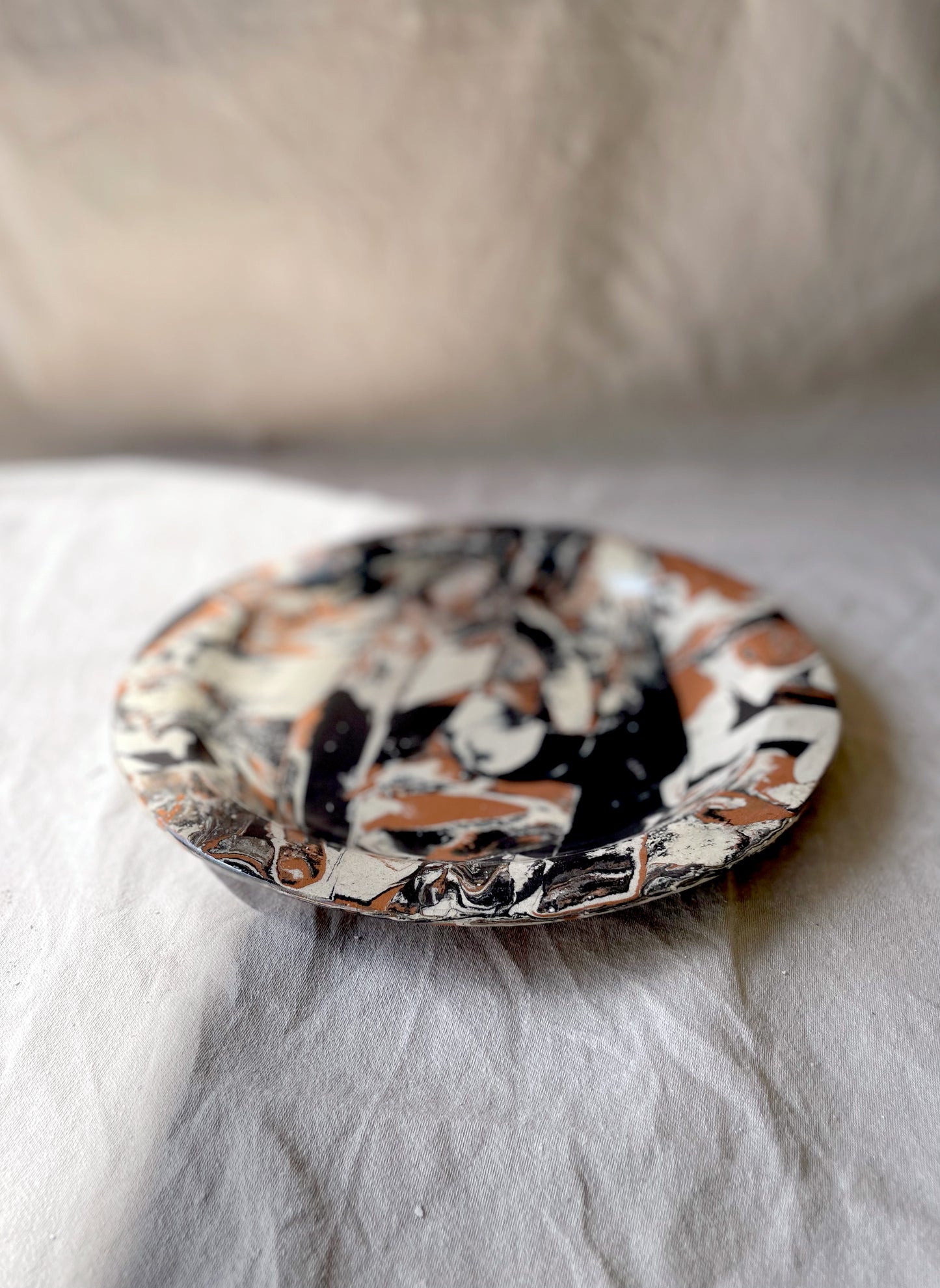 handmade ceramics, marbled plate, side angle