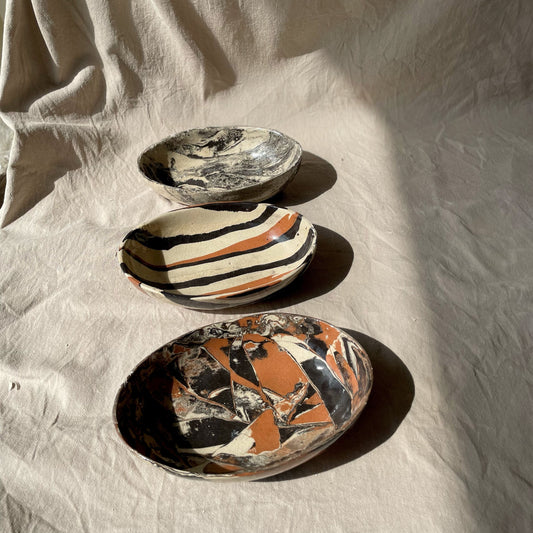 three marbled ceramic oval platters 